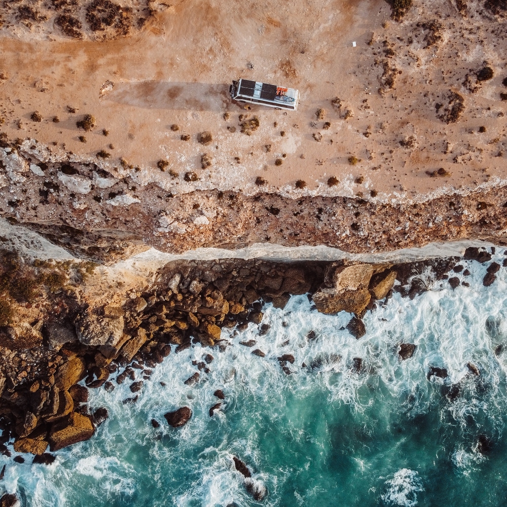 aerial view of caravan parked near the edge of bunda cliffs in south australia