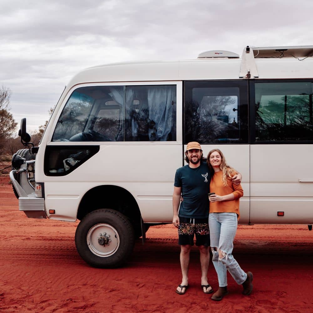 A man and woman standing in front of a van. A way to get around to the top 13 best things to do in Alice Springs for free. Found in Alice Springs.
