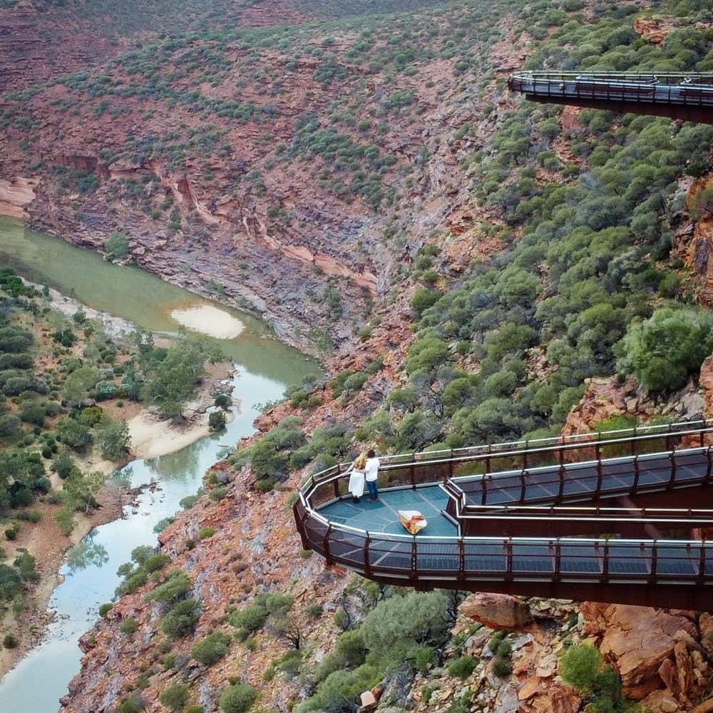 Couple looking at the Kalbarri Skywalk views. Two platforms in view over the gorge.