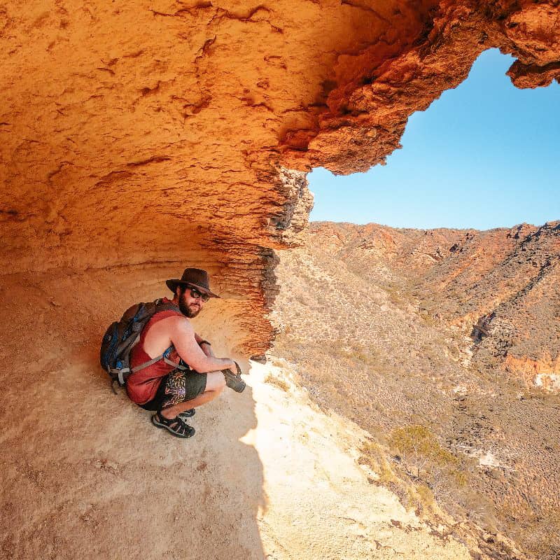Adventure seekers exploring Shot Hole Canyon, a popular tourist attraction in Exmouth, Western Australia, with its dramatic landscapes.