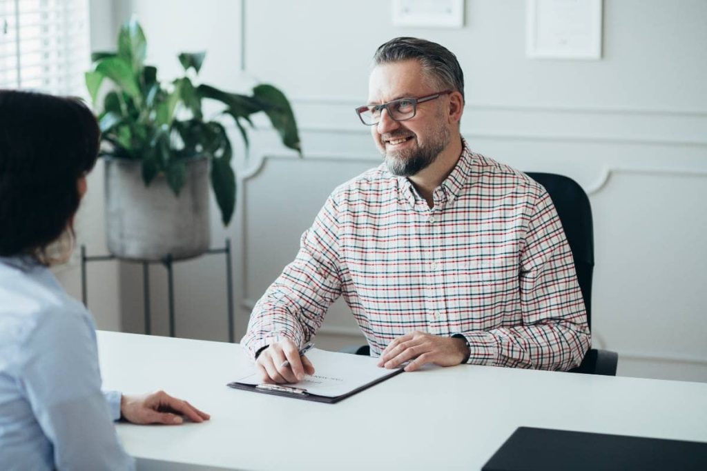 Smiling boss and employer discussing remote work opportunities