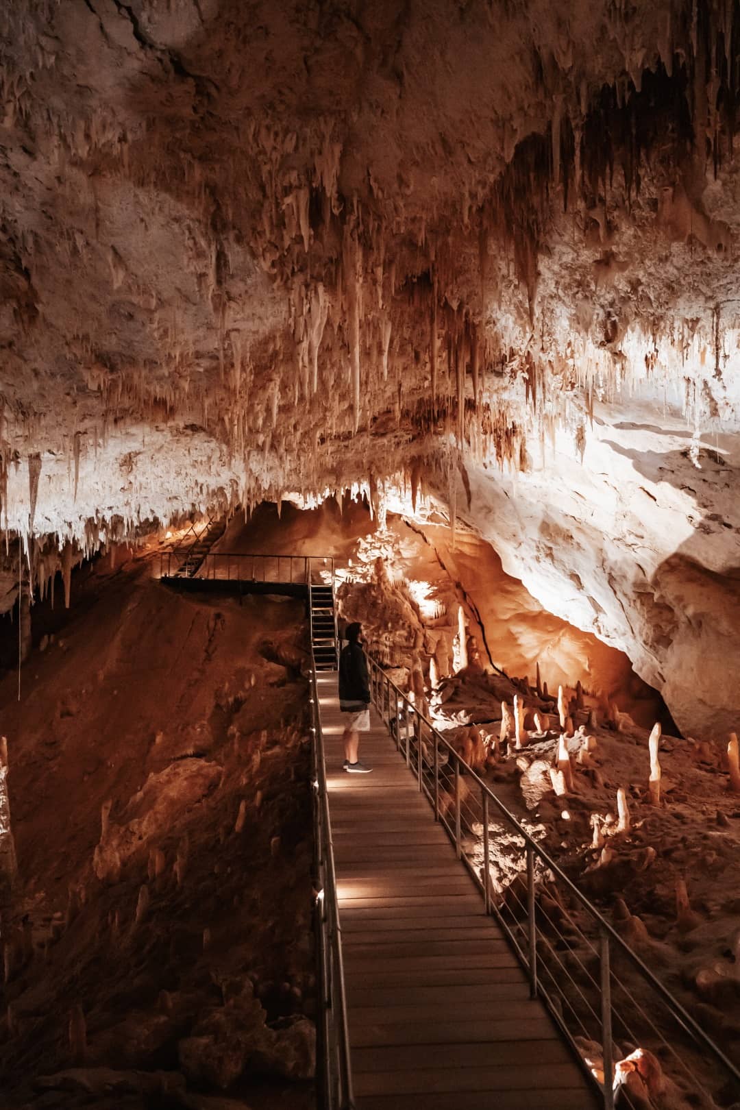 Chris of Salt and Charcoal watching Margaret River's Underground Cave stalactites and stalagmites in Western Australia