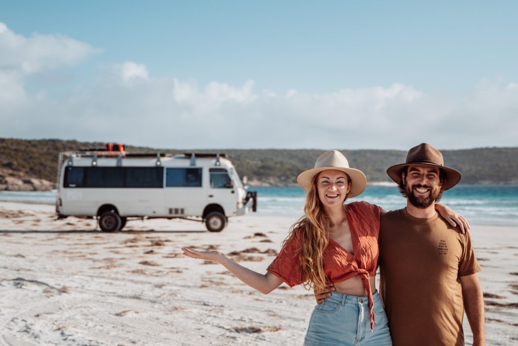 Chris and Bec with Bunji the bus on a WA beach