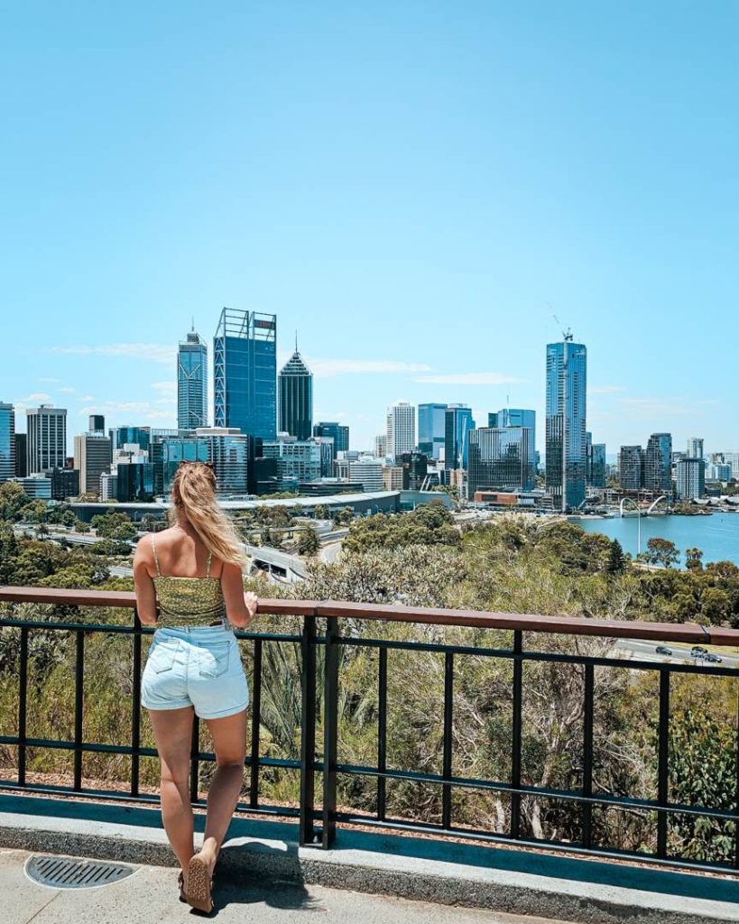 A person overlooking the Perth city skyline from a viewpoint in Kings Park, Western Australia.