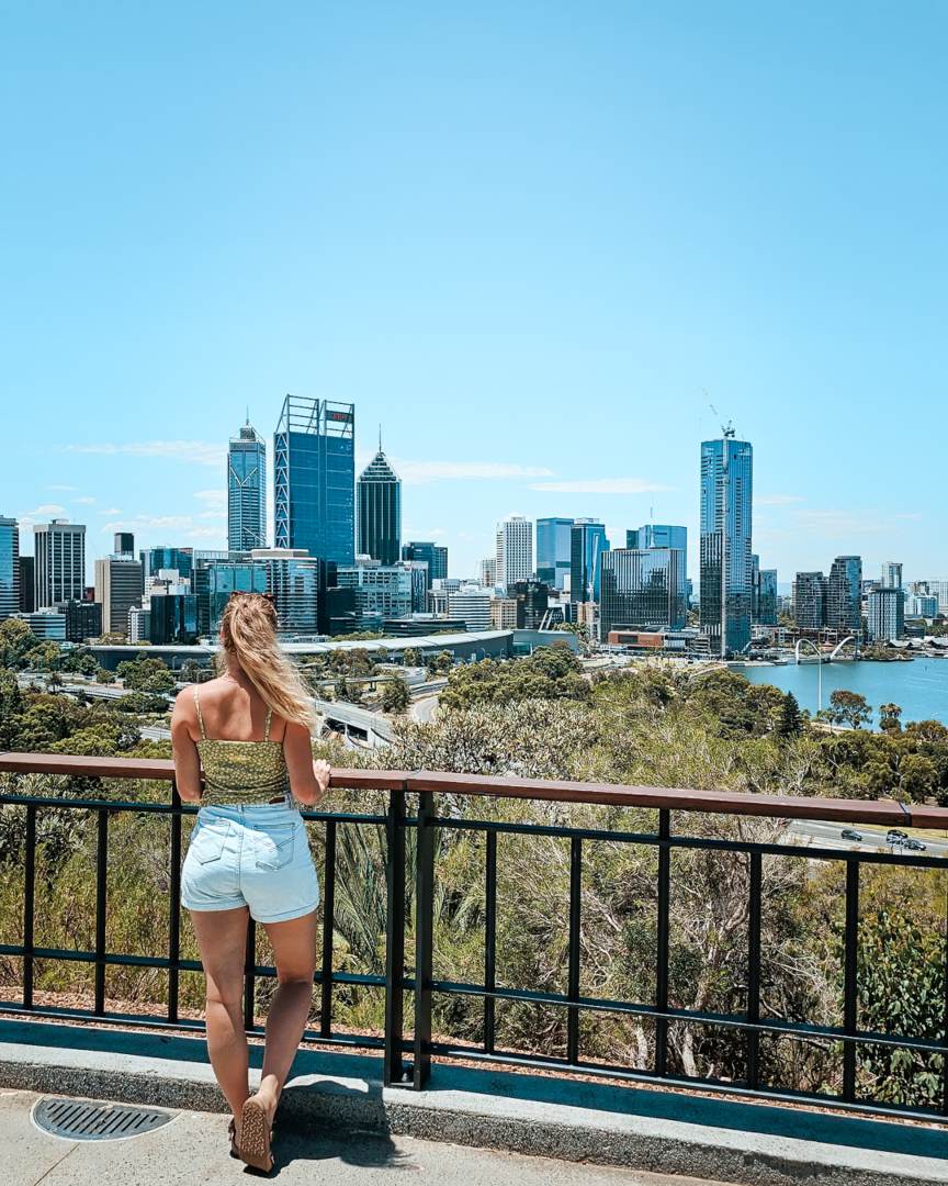 A person overlooking the Perth city skyline from a viewpoint in Kings Park, Western Australia.