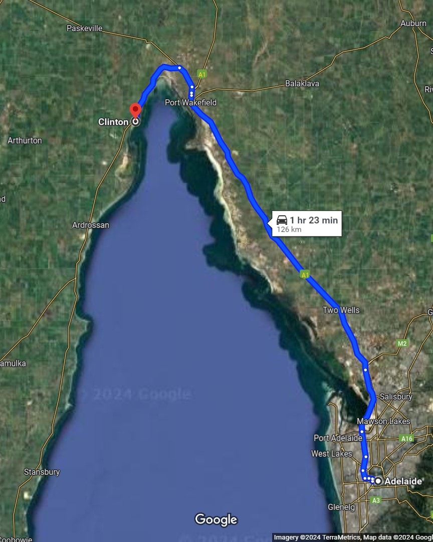 A map showing the driving route from Adelaide to Port Clinton, South Australia, covering approximately 126 kilometers along major highways with an estimated travel time of about 1 hour and 23 minutes.