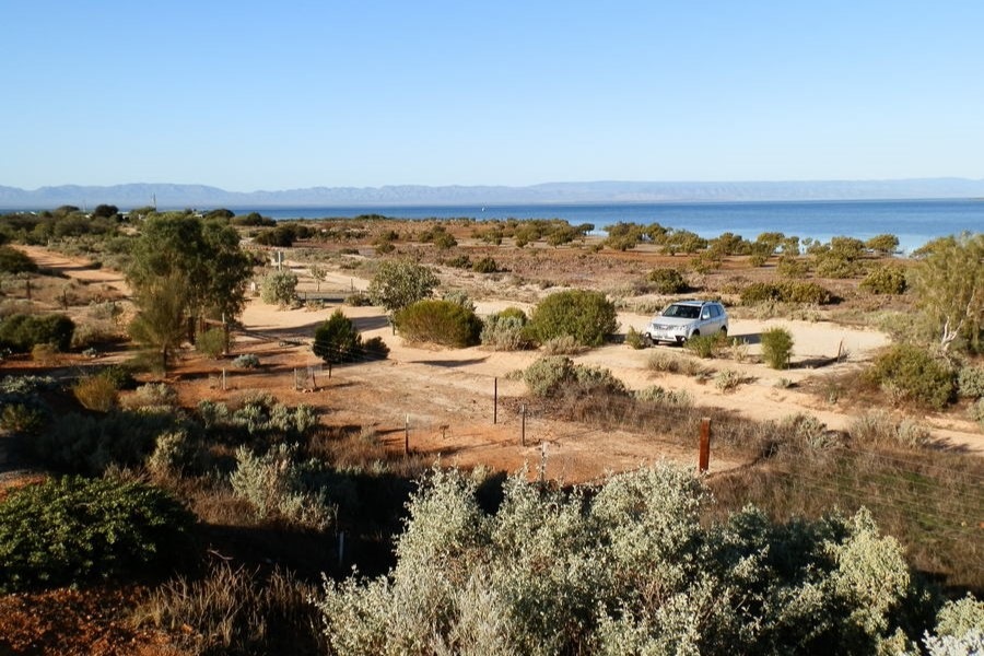 Blanche Harbour with views of Spencer Gulf in Port Augusta, South Australia, surrounded by sparse vegetation and distant mountains.