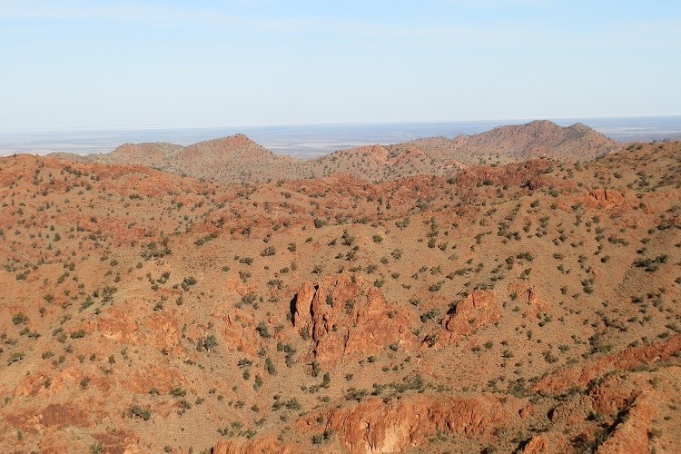 An expansive view from Sillers Lookout over the rugged Ragged Ranges, highlighting the dramatic landscape of Arkaroola Wilderness Sanctuary in South Australia.