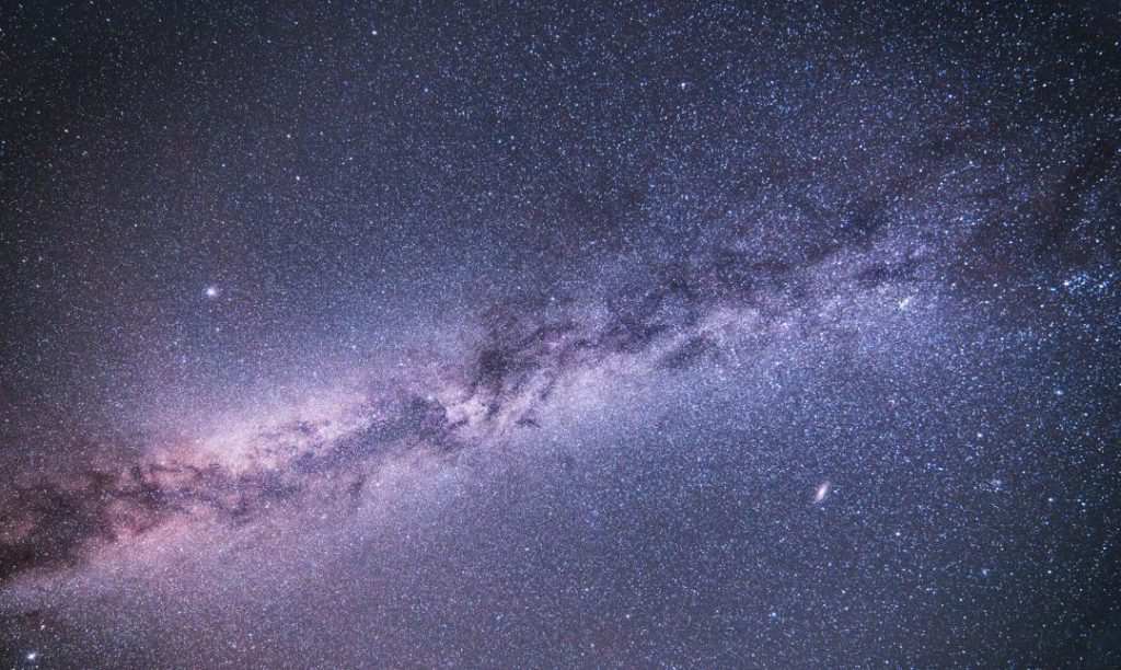 A breathtaking view of the Milky Way galaxy stretching across the night sky above Arkaroola Wilderness Sanctuary in South Australia, showcasing the area's dark-sky beauty.