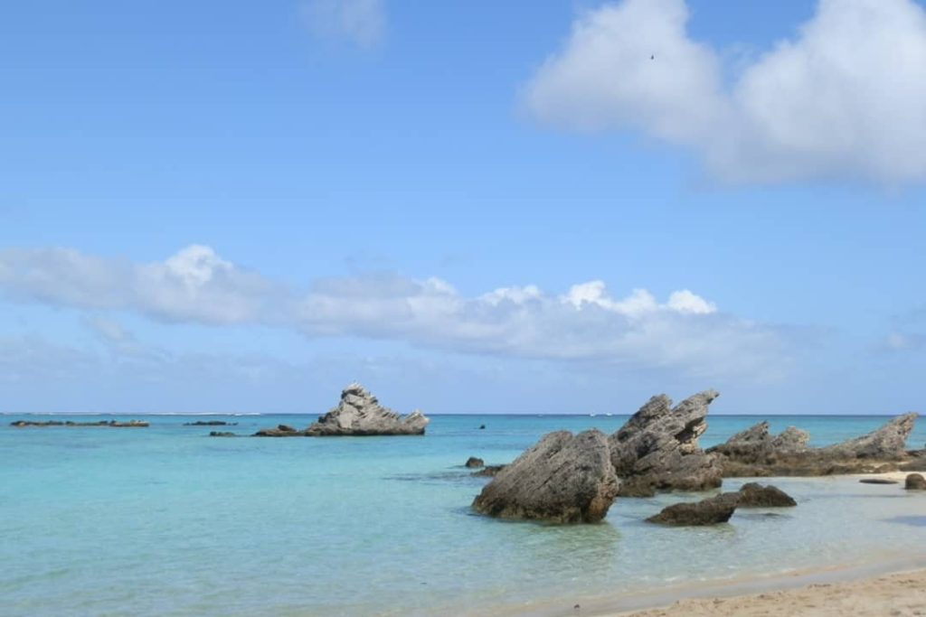 The northern end of Lagoon Beach on Lord Howe Island, Australia, has distinctive rock formations emerging from the clear, turquoise water.