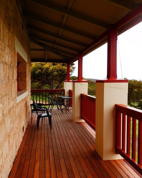 The veranda of the historic Engineer’s House in Dhilba Guuranda-Innes National Park, Yorke Peninsula, South Australia, showcasing the beautiful red accents and wooden flooring