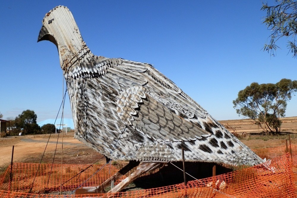 Big Mallee Fowl sculpture surrounded by orange safety fencing.