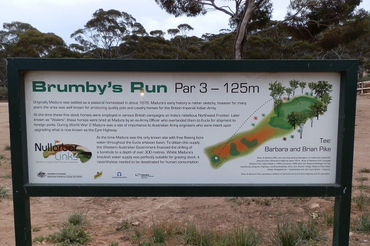 Informational sign for Brumby’s Run, a par 3, 125-meter hole at Nullarbor Links golf course, detailing its history and significance near Madura Pass Roadhouse.