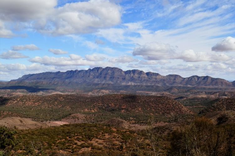 The Bunbinyunna Range viewed from Bridle Gap in the Flinders Ranges, a must-see on any Flinders Ranges itinerary, with rugged mountains and a cloud-filled sky.
