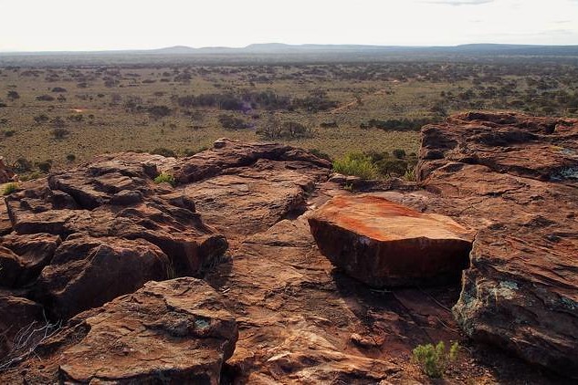 Rocky terrain at the summit of Wild Dog Hill, overlooking the vast landscape of Whyalla Conservation Park, South Australia.