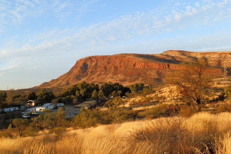 Campground nestled at the base of red hills, a convenient base for visitors exploring things to do in Tom Price.