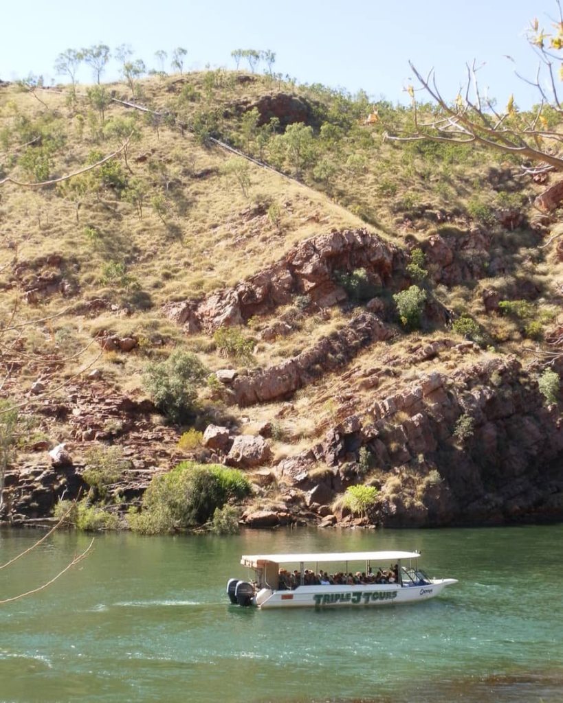 A tour boat cruising the Ord River in Kununurra.