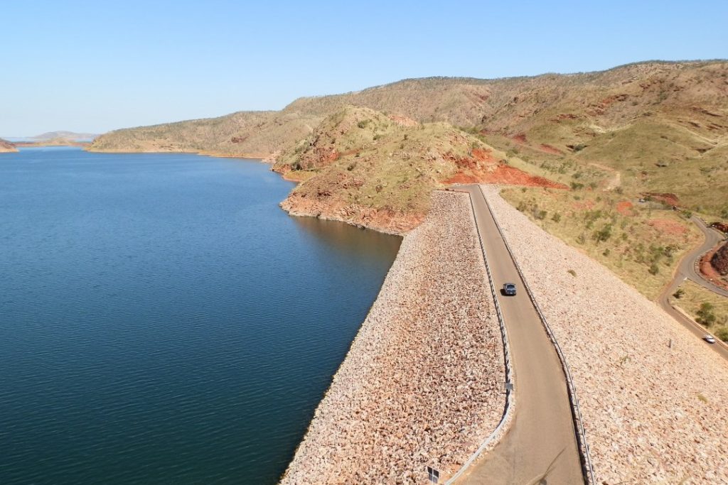 The dam wall at Lake Argyle, offering expansive views of the lake and surrounding hills.