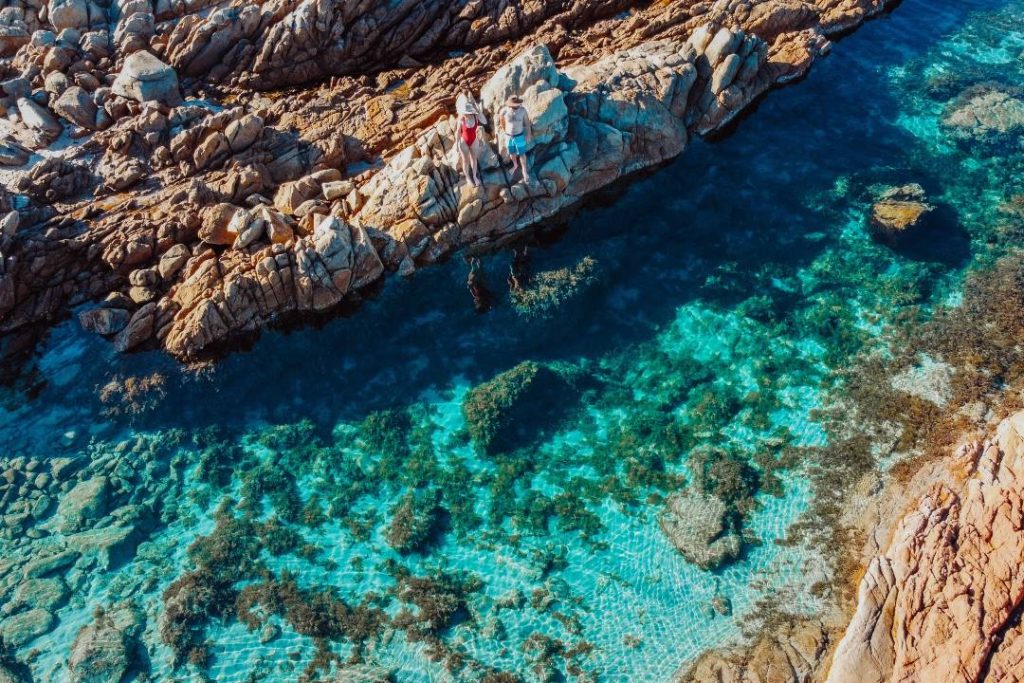 Aerial view of turquoise water and rocky shoreline at The Aquarium in Yallingup, Western Australia.