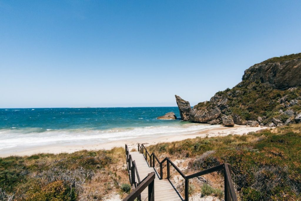 Natural rock arch known as "The Window" at Windy Harbour WA, framing a view of the bright blue ocean beyond, showcasing the unique geological formations along the rugged coastline.