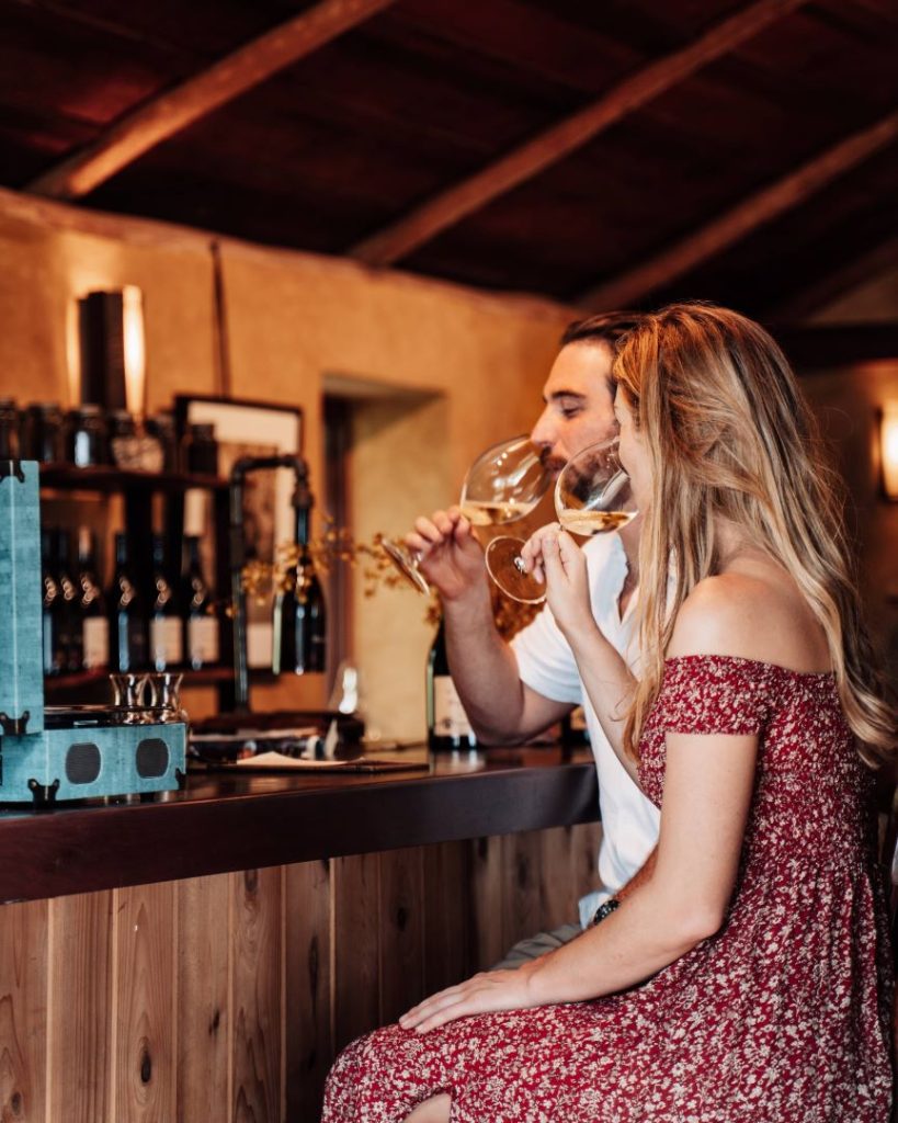 Young couple doing a wine tasting tour, an epic activity to do in Albany, WA