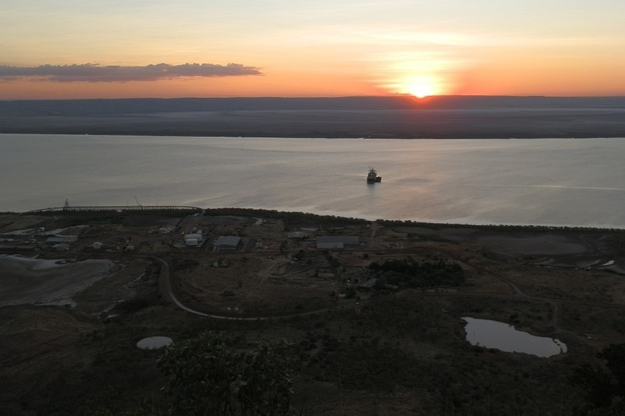 A panoramic view from Five Rivers Lookout in Wyndham, Western Australia, Australia, with the sun setting over the river delta and distant hills.