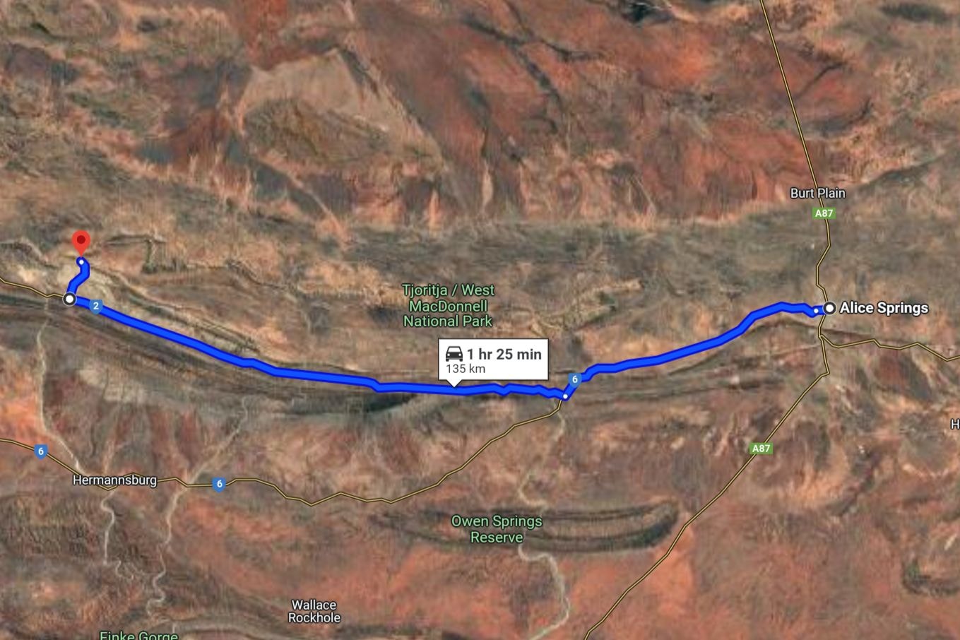 Satellite map showing a driving route from Alice Springs to Ormiston Gorge in the Northern Territory, Australia. The blue path covers 135 km, with an estimated travel time of 1 hour and 25 minutes, passing through Tjoritja / West MacDonnell National Park. A helpful visual for planning a road trip and exploring things to do in Ormiston Gorge, such as hiking, swimming, and wildlife spotting in the surrounding natural reserve.