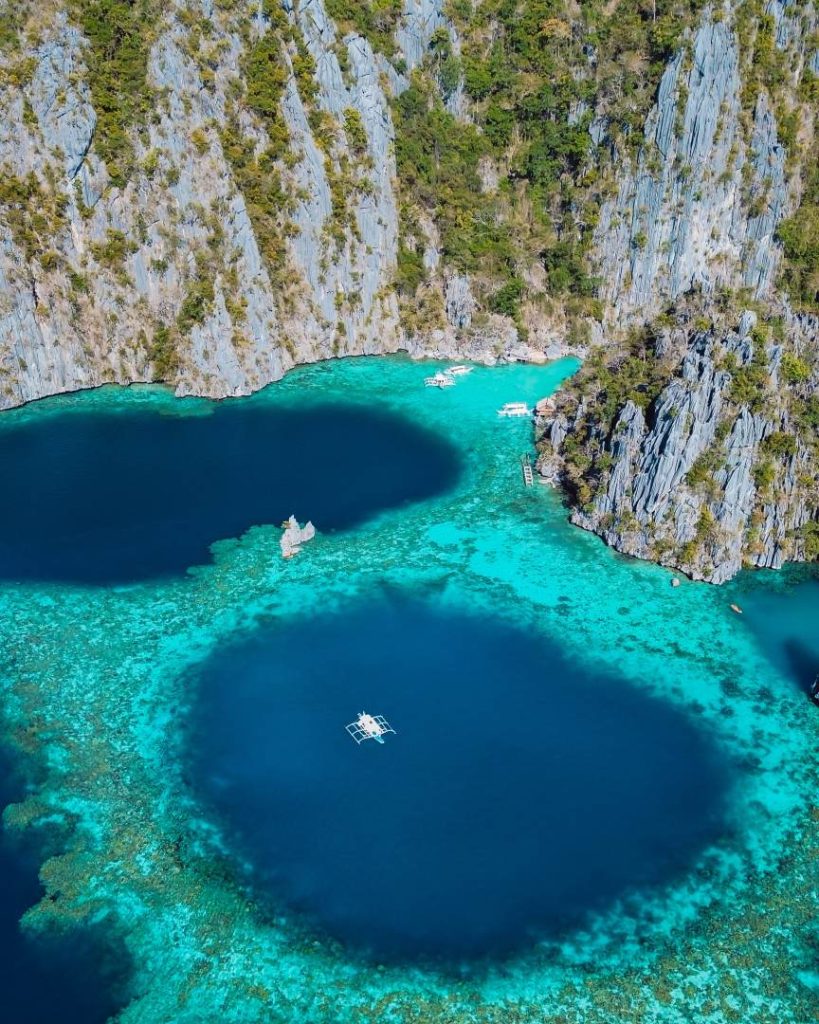 Drone shot of Twin Lagoons in Coron, Palawan, with turquoise water and dramatic limestone cliffs, a highlight during the best months to visit the Philippines.