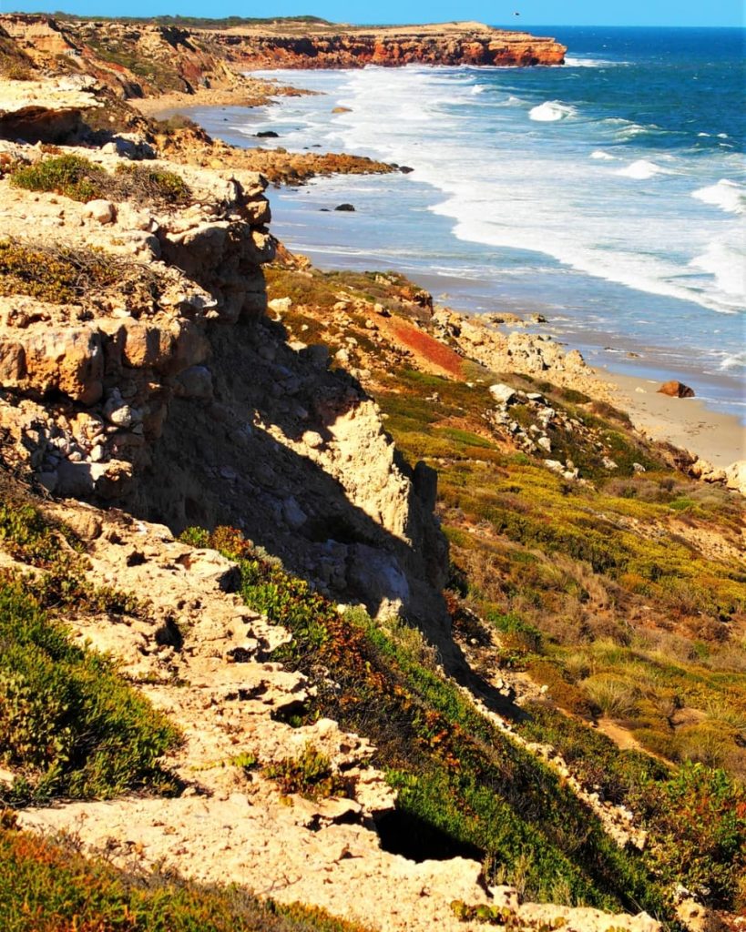Cliffside view toward Suicide Point on South Australia’s Yorke Peninsula, with rugged rocks and crashing waves—classic coastal scenery for road trips in Australia.