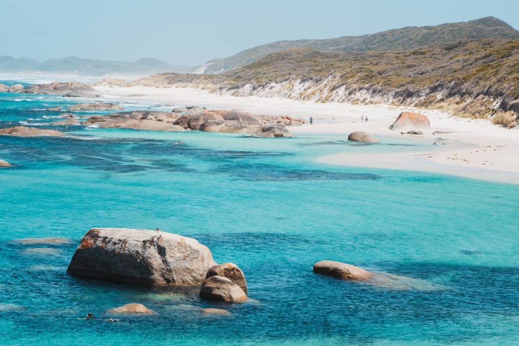 The turquoise waters and granite boulders of Greens Pool in Denmark shimmer under the sun, a must-see on any Perth to Bremer Bay road trip.