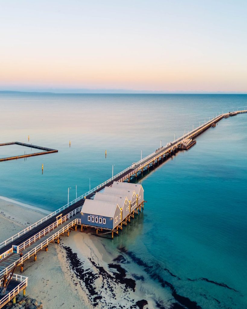 aerial view of the busselton jetty over the ocean, in western australia