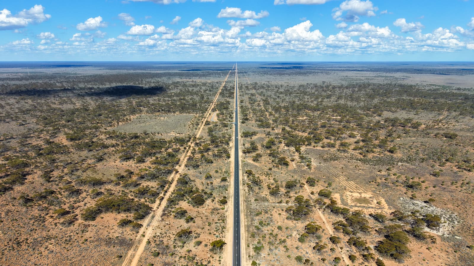 An open highway running dead straight across the Nullarbor Plain